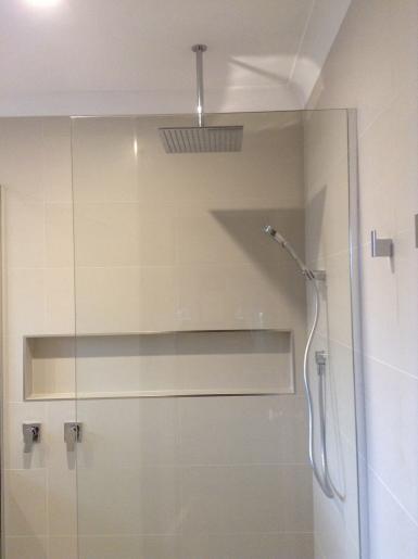 Fixed glass panel shower screen, ceiling shower head 